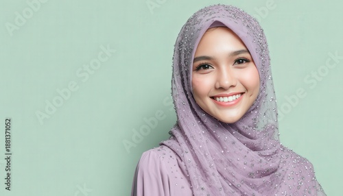 Wallpaper Mural Young woman wearing a sparkling lavender headscarf smiles confidently against a light background Torontodigital.ca
