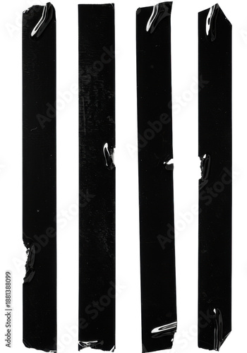 Four vertical strips of black gaffer tape with distressed texture, fingerprints and torn edges isolated on a white background. Abstract grunge design concept