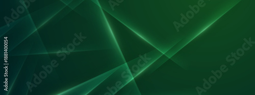 Vibrant emerald green abstract background with sharp intersecting light beams and triangular facets