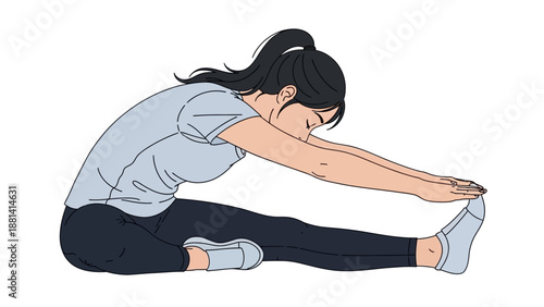 A beautiful fit brunette model in active fashion performs a healthy yoga stretching pose on a studio floor for fitness training