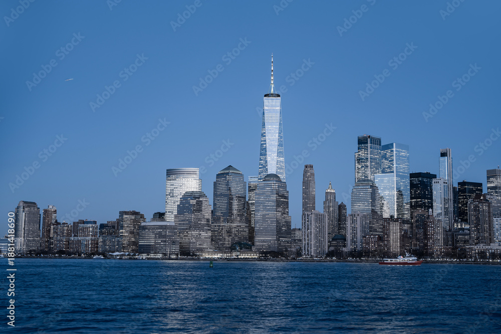 Obraz premium NYC Manhattan skyscrapers panoramic cityscape. NYC Manhattan skyline wide banner. NYC Manhattan skyline with glass towers. NYC Manhattan skyline urban landscape.