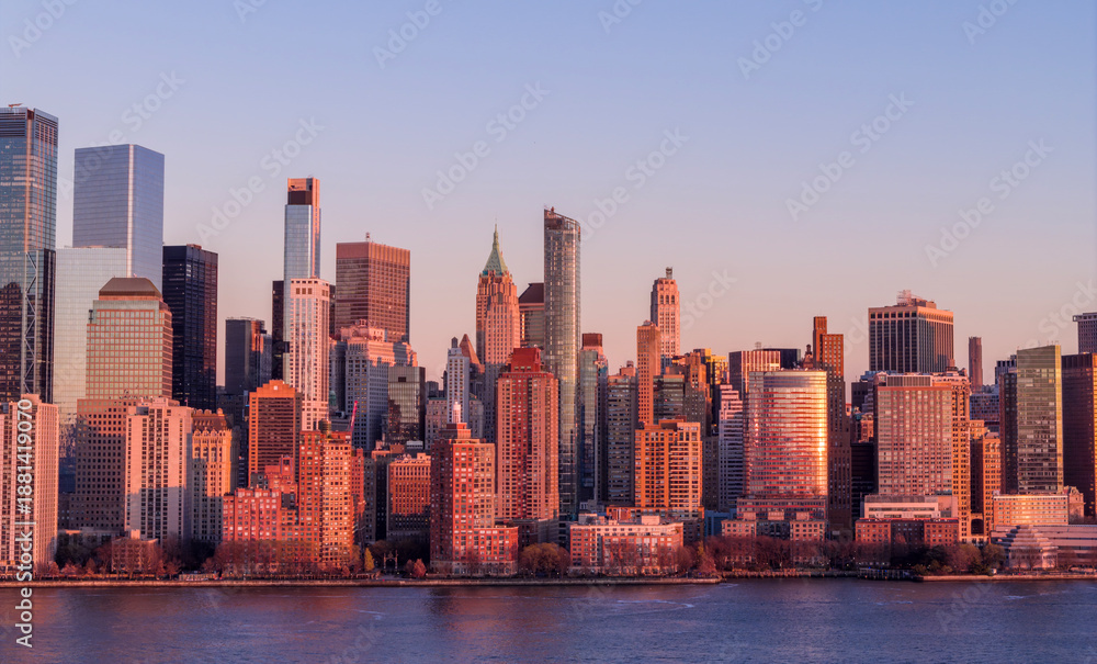 Fototapeta premium New York skyline with Tower in panoramic dusk view. NYC panoramic landscape at dusk. New York City wide panoramic skyline at dusk. New York aerial panoramic view of Manhattan skyscrapers.