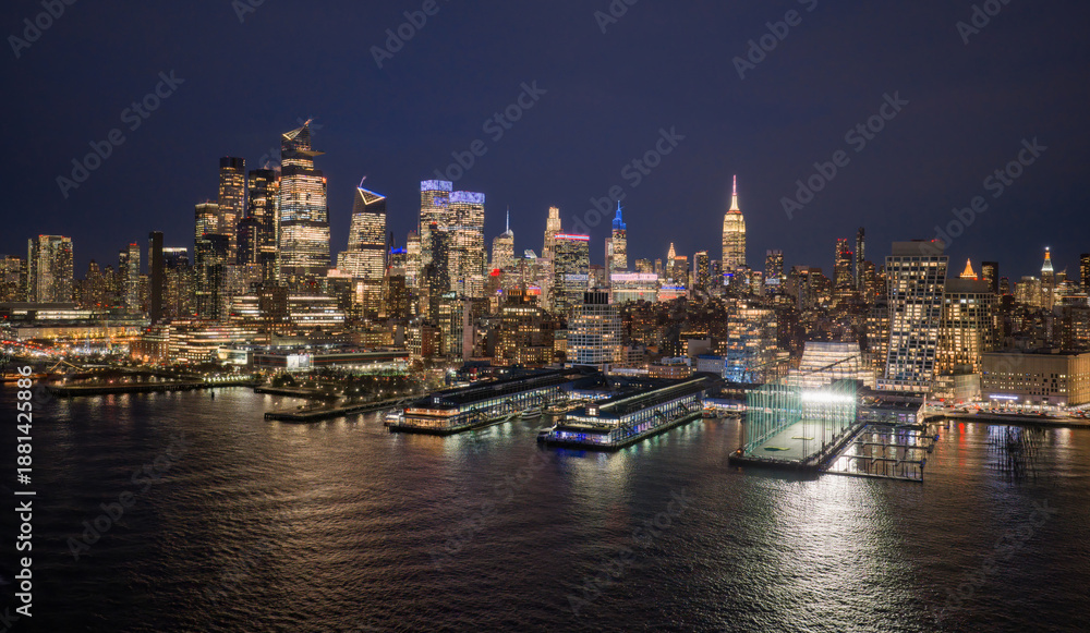 Fototapeta premium New York City panoramic skyline. NYC aerial skyline over downtown Manhattan. NewYork night skyline. New York skyline with Tower. NYC cityscape. New York waterfront. New York aerial view.