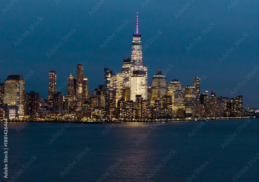 Obraz premium New York night metropolis. NYC skyscrapers at night. NewYork City downtown at night. Lower Manhattan skyline. New York landscape. New York big American City. New York cityscape waterfront.