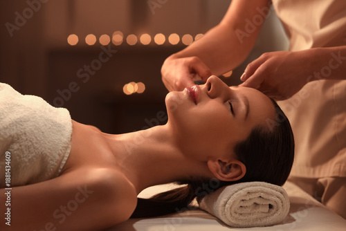 Young woman having facial m...