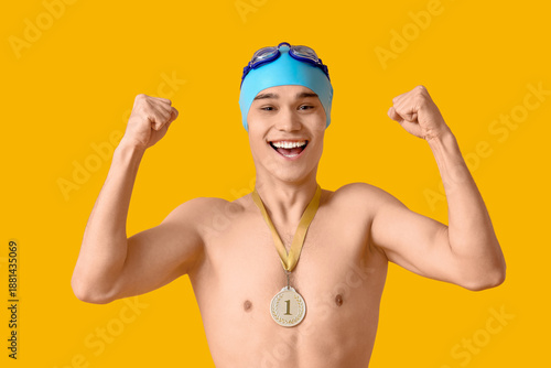 Happy male swimmer with fir...