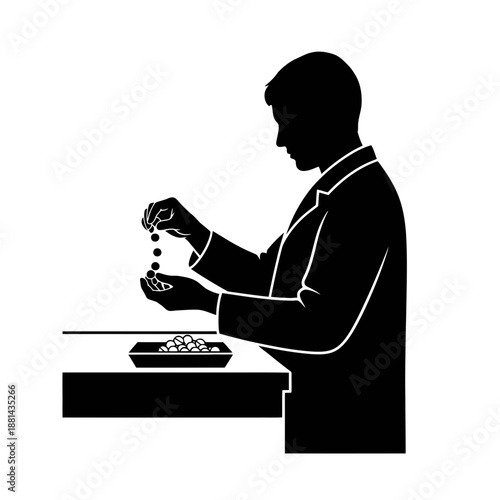 Focused Man Counting Seeds in Tray Silhouette for Agricultural Research and Sustainable Farming Concept