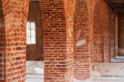 Red brick columns and window.