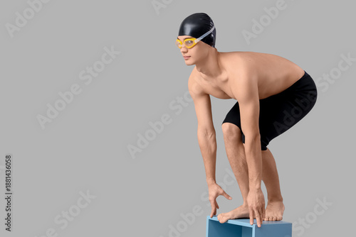 Male swimmer on light backg...
