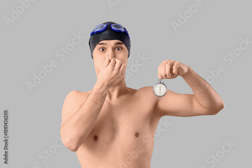 Young male swimmer with sto...