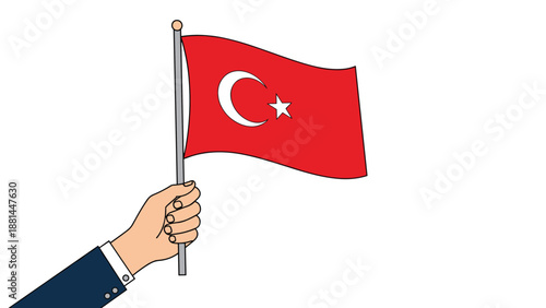 Close up of a person hand in a suit sleeve holding up the national flag of Turkey featuring the white crescent and star on red.