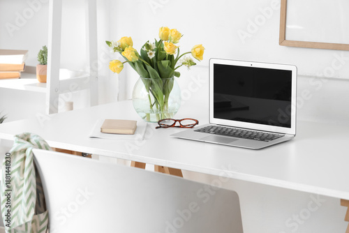 Vase with flowers and blank...