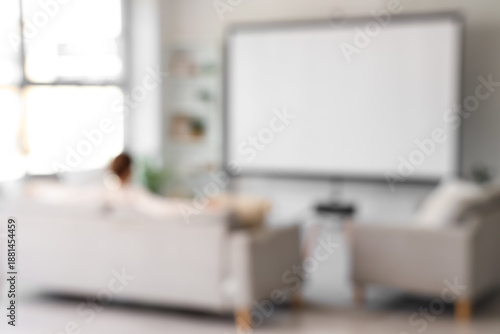 Blurred view of woman sitti...