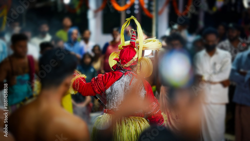Wallpaper Mural Pottam Theyyam artist performing ritual dance inside a crowd during a temple festival in Kerala, India.  Torontodigital.ca