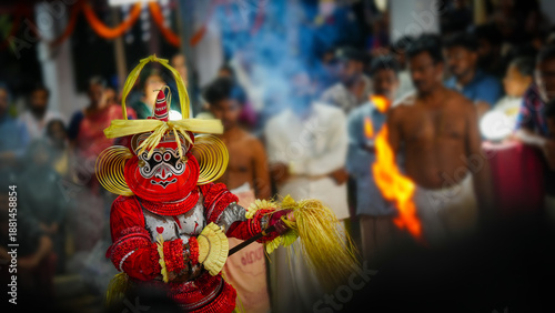 Wallpaper Mural Pottam Theyyam artist dancing inside a crowd during a traditional temple ritual in Kerala, India, captured with selective focus. Torontodigital.ca