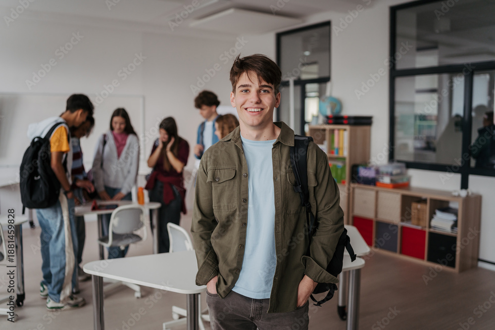 Fototapeta premium Confident teen student in classroom in school.