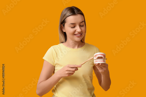 Young woman with toothbrush...