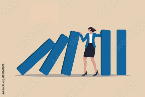Woman preventing falling dominoes representing business challenges