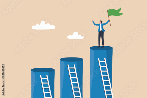 Man standing on top of a tall column holding a flag