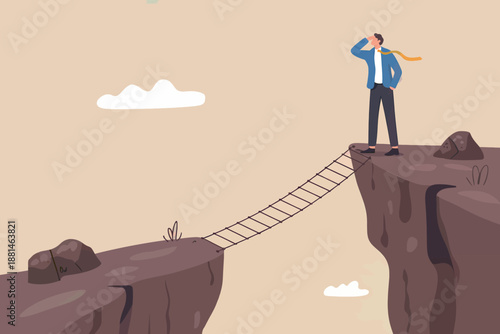 Man standing on cliff edge looking across rope bridge towards future opportunities