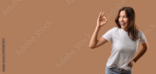 Happy young woman showing O...