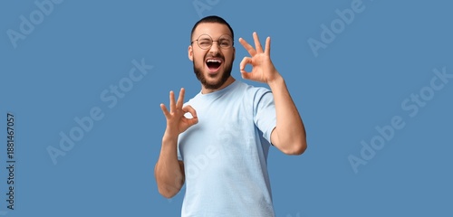 Happy young man showing OK ...