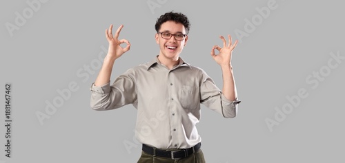 Happy young man showing OK ...