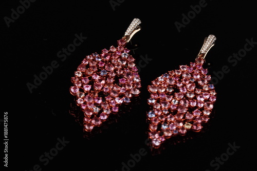 Photography Elegant leaf-shaped dangle earrings featuring soft pink gemstones in a graceful, nature-inspired design