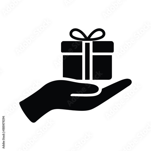 Silhouette of a hand holding a gift box with ribbon