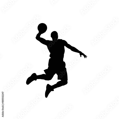 Silhouette of a basketball player jumping and dunking a ball
