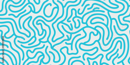 Intricate blue patterns swirling in an abstract design on a white surface viewed from directly above