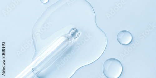 Wallpaper Mural Drop of cosmetics and a pipette on a blue background. A product for skin, face or hair care. Torontodigital.ca