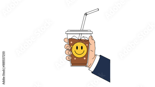 Person in a dark suit holding a plastic cup of iced coffee decorated with a yellow happy smiley face sticker.
