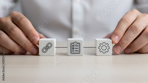 Service design and process management concept — hands arranging icon blocks

