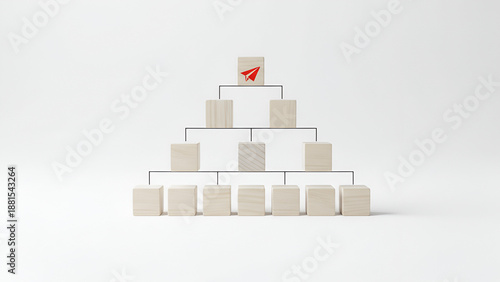 Pyramid of wooden blocks with flag on top — teamwork, growth, and milestones concept

