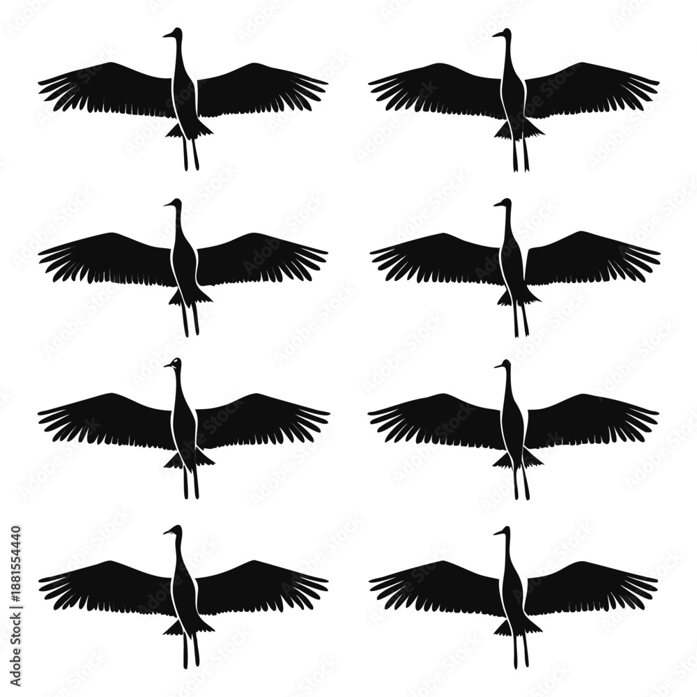 Obraz premium A repeating pattern of elegant cranes in flight depicted as a striking black silhouette high quality