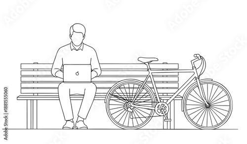 Man sitting on bench with bicycle working on laptop computer outdoors in daytime