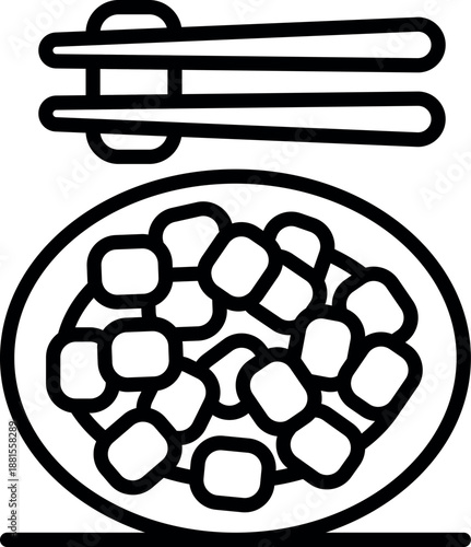 Chopsticks poised above a plate of cubed tofu, ready to enjoy a delicious and healthy meal