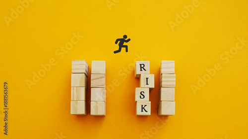 Wallpaper Mural Risk Assessment and Strategic Decision Making in Business Leadership with Wooden Blocks Obstacle and Forward Jump Symbol on Yellow Background Torontodigital.ca