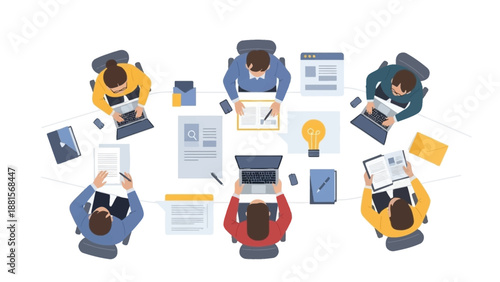 People working on laptops and paperwork together.