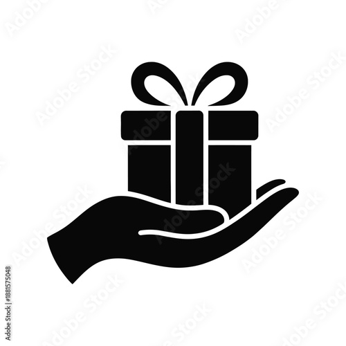 Silhouette of a hand holding a gift box with ribbon