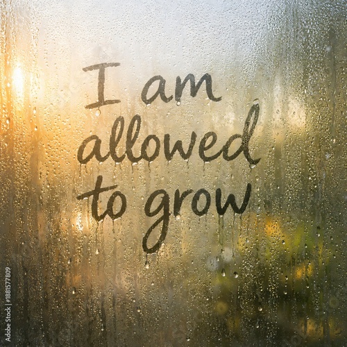 I Am Allowed to Grow Affirmation on Fogged Glass Representing Personal Growth and Self Permission