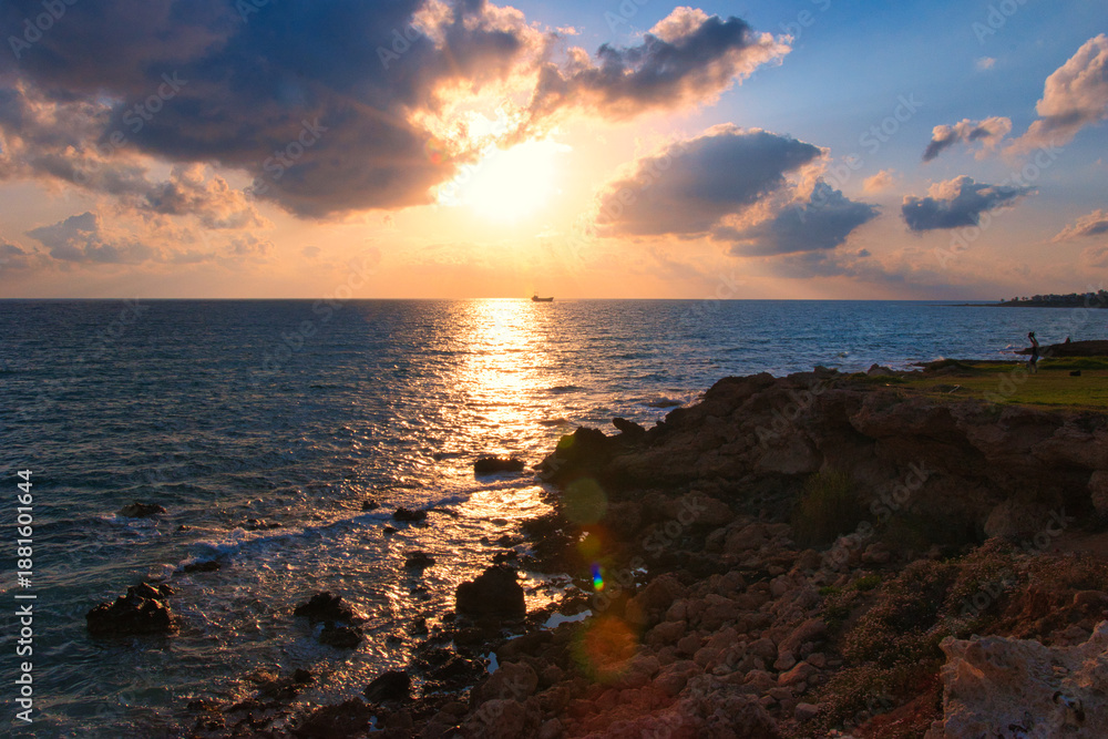 Obraz premium Beautiful sunset sky at beach in Paphos Cyprus showing Demetrios shipwreck and Venus beach 04 June 2023