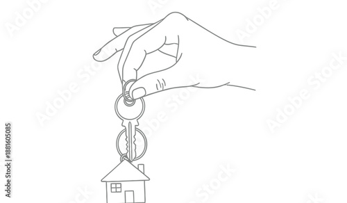 Hand holding key with house symbol representing home ownership and real estate concepts