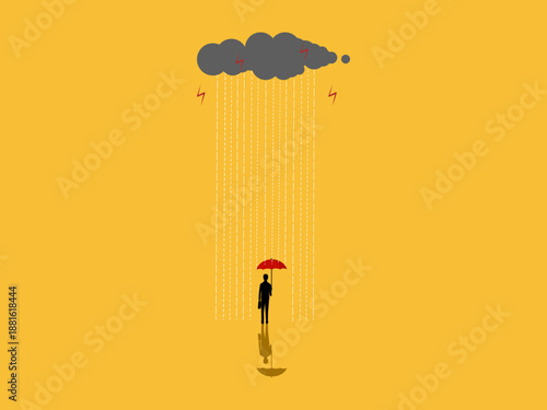 businessman held an umbrella to protect himself from the rain