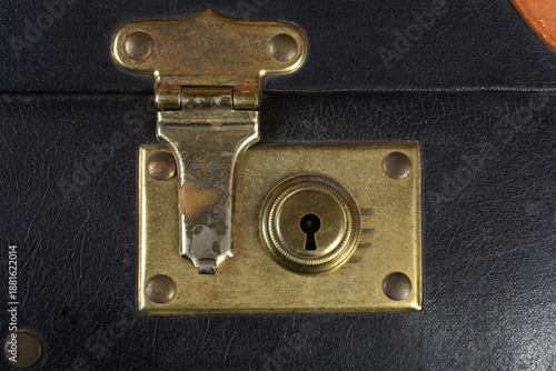 Bilde på lerret A close-up shot captures the worn, tarnished brass lock plate and keyhole set in
