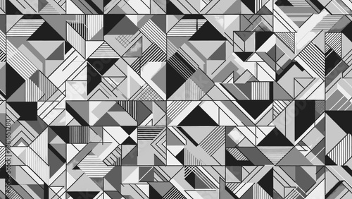 Geometric shapes in various shades of gray form a complex pattern viewed from directly above creating an abstract illustration