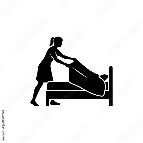 Housekeeper making bed black silhouette icon. Hotel service and domestic cleaning vector illustration. Female maid arranging sheets symbol