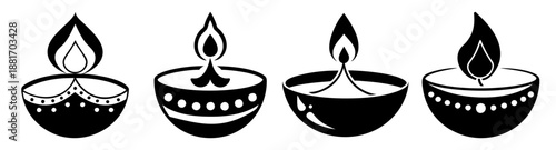 Traditional indian diya lamps with burning candles for diwali festival