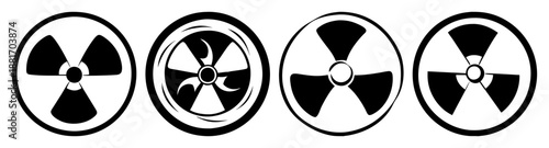 Four black and white radiation symbols in a row